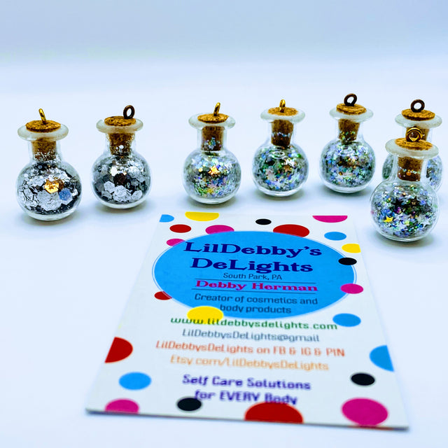 Bottle of glitter, silver stars.