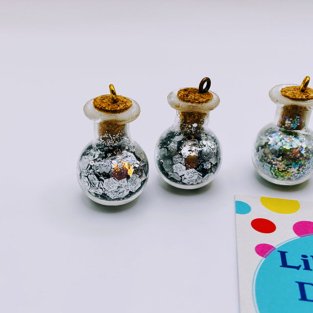 Bottle of glitter, silver stars.