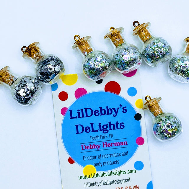 Bottle of glitter, silver stars.