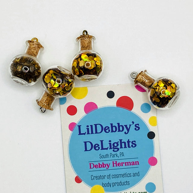 Bottle of glitter, gold.