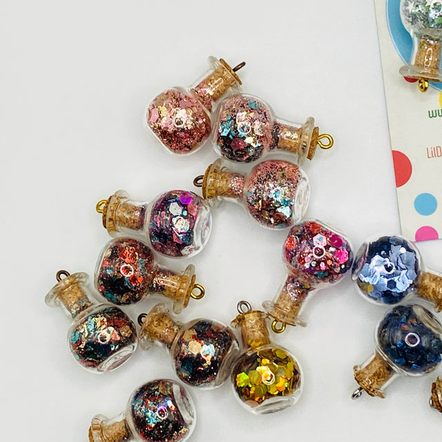 Bottle of glitter, gold.