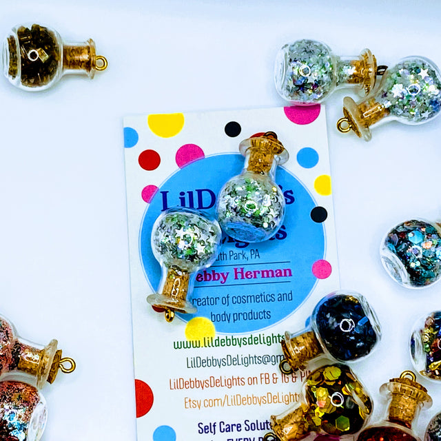 Bottle of glitter, silver stars.