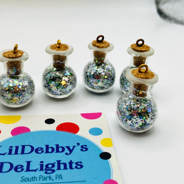 Bottle of glitter, silver stars.