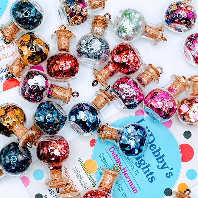 Bottle of glitter, silver stars.